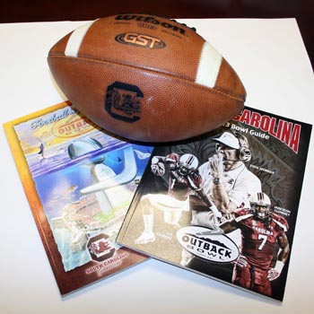 Game-Used Football, Official Program, & Bowl Media Guide - Outback Bowl, South Carolina vs. Michigan